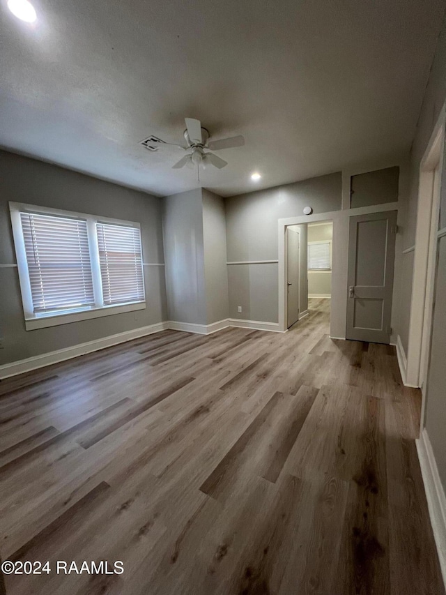 unfurnished room with light hardwood / wood-style flooring and ceiling fan