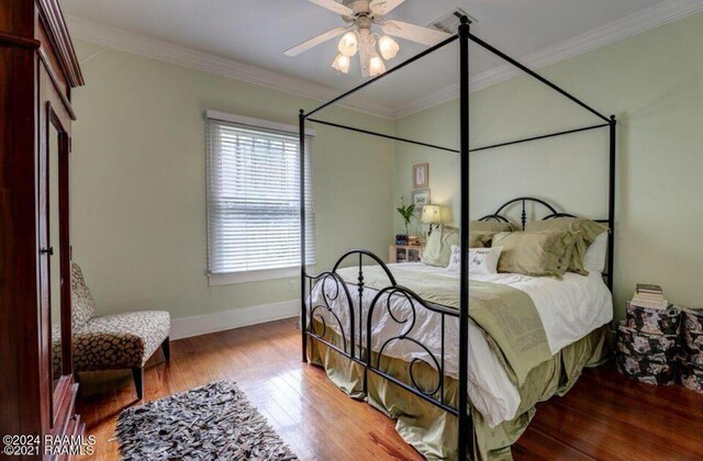 1015 Lee Ave, Lafayette, LA 70501 - bedroom featuring wood finished floors, baseboards, ornamental molding, and a ceiling fan