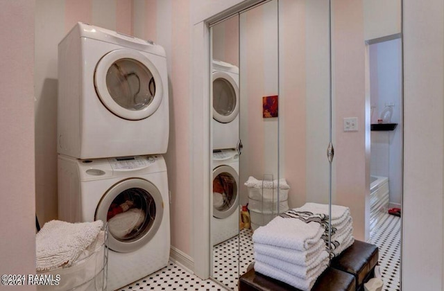 1015 Lee Ave, Lafayette, LA 70501 - washroom featuring stacked washer and clothes dryer and light floors