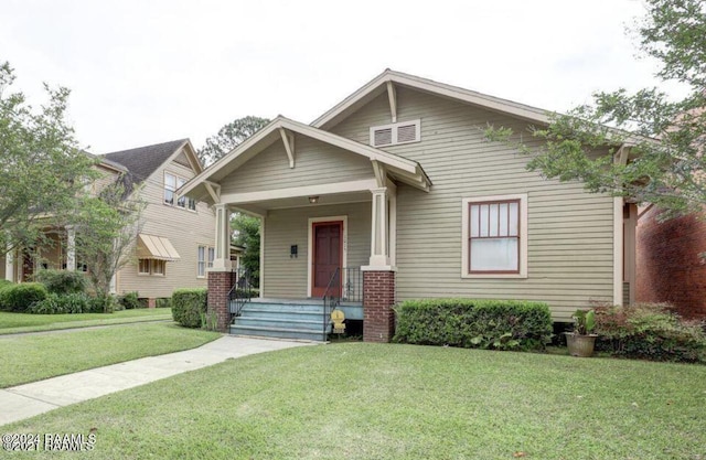 1015 Lee Ave, Lafayette, LA 70501 - view of front of home featuring a front yard and covered porch