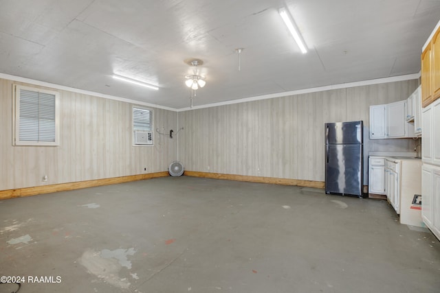 interior space featuring black fridge, sink, and ceiling fan