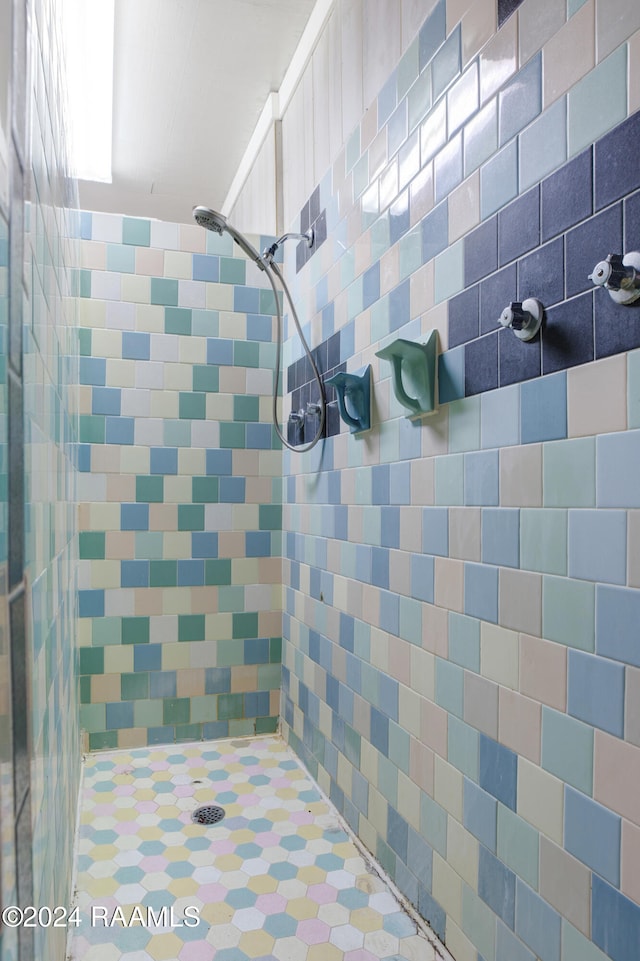 interior space featuring tile walls and tiled shower