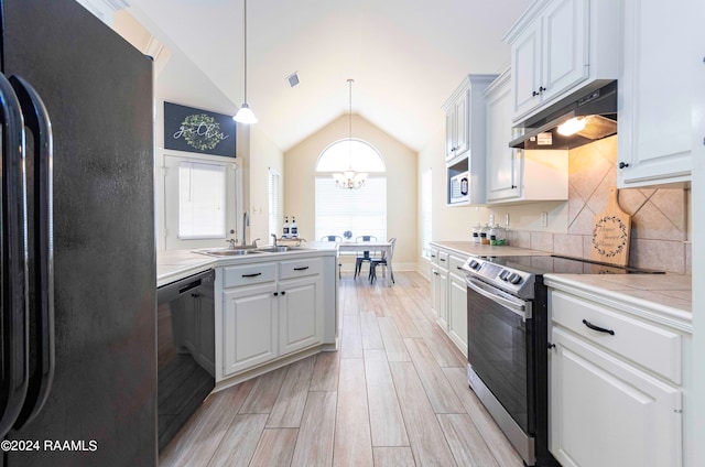 kitchen featuring electric stove, dishwasher, sink, white cabinetry, and fridge