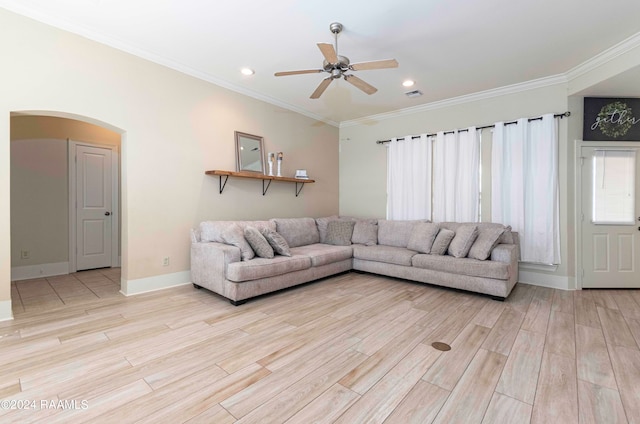 living room featuring ceiling fan, light hardwood / wood-style floors, and crown molding