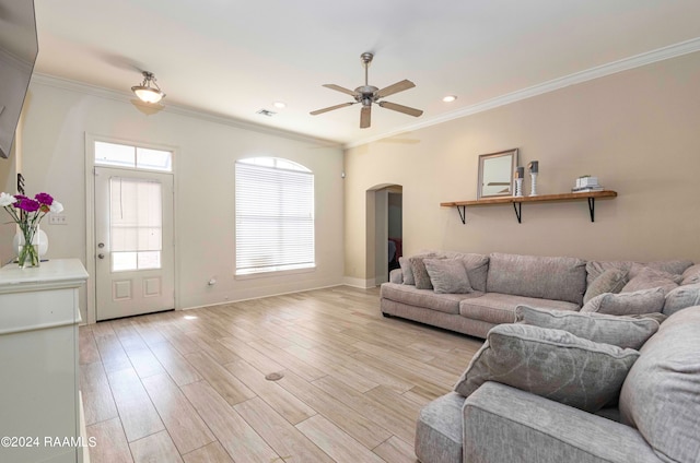 living room featuring ceiling fan, light hardwood / wood-style flooring, and ornamental molding