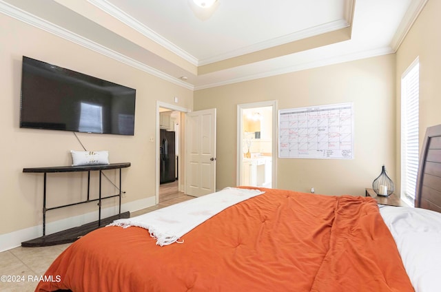 tiled bedroom with connected bathroom, black refrigerator with ice dispenser, a tray ceiling, and crown molding