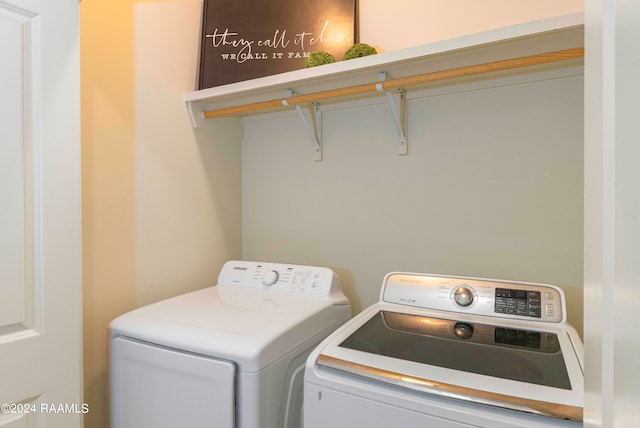 clothes washing area featuring independent washer and dryer