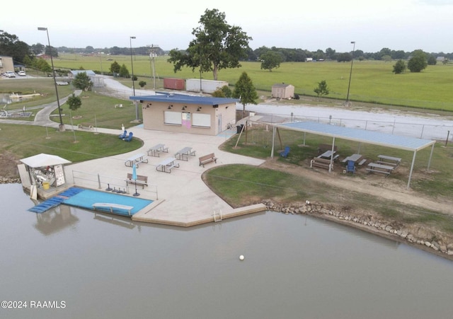 view of swimming pool with a patio and a yard