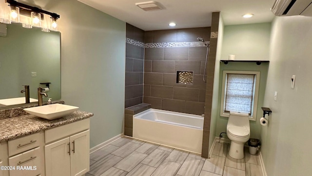 full bathroom with toilet, tiled shower / bath combo, vanity, and an AC wall unit