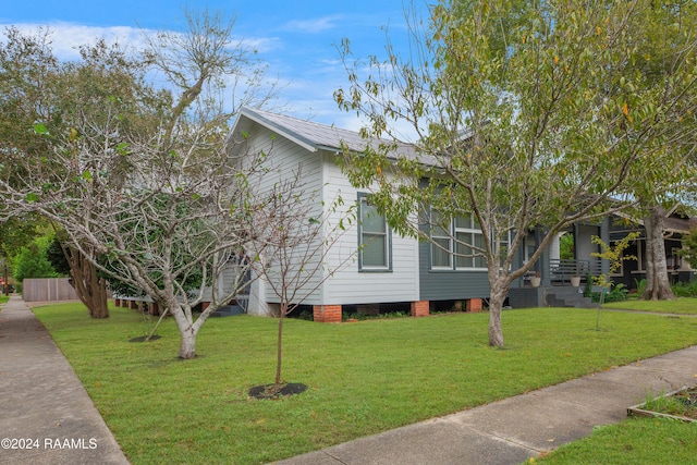 228 Cherry St, Lafayette, LA 70506 - view of property exterior with a yard