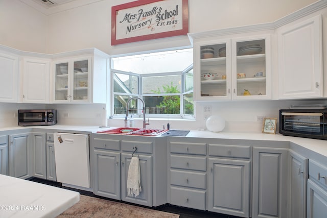 kitchen featuring sink, gray cabinetry, white cabinets, and white dishwasher