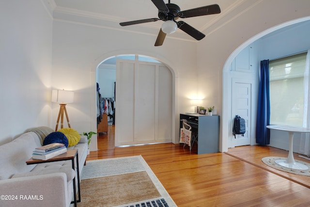228 Cherry St, Lafayette, LA 70506 - sitting room with wood finished floors, arched walkways, ornamental molding, and ceiling fan