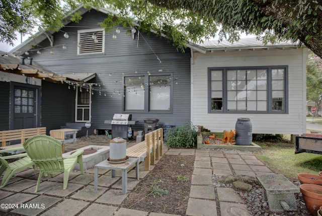 back of property with a patio