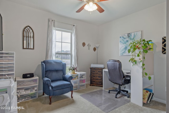 office area with ceiling fan and carpet flooring