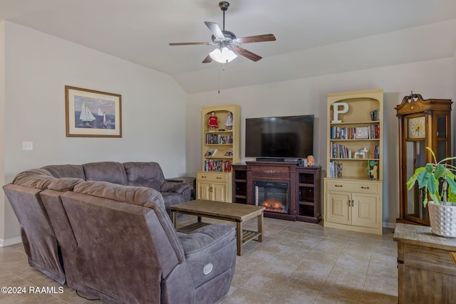 tiled living room featuring ceiling fan and vaulted ceiling