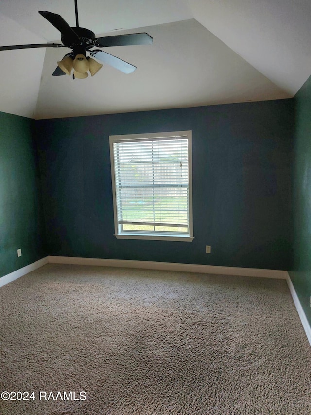 unfurnished room with lofted ceiling, carpet, and ceiling fan