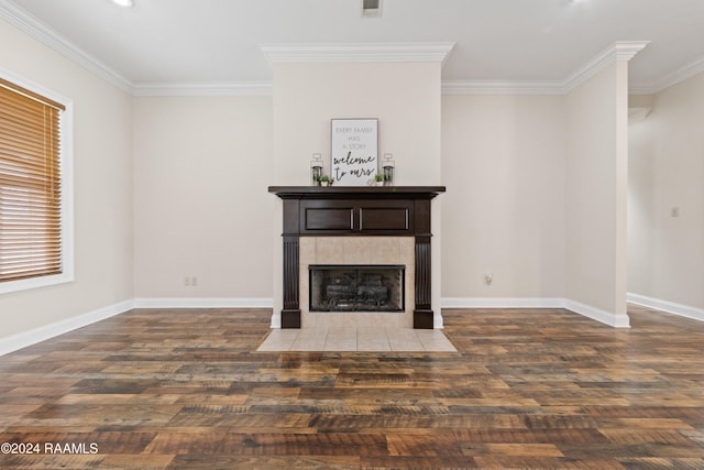 unfurnished living room with a fireplace, crown molding, and dark wood-type flooring