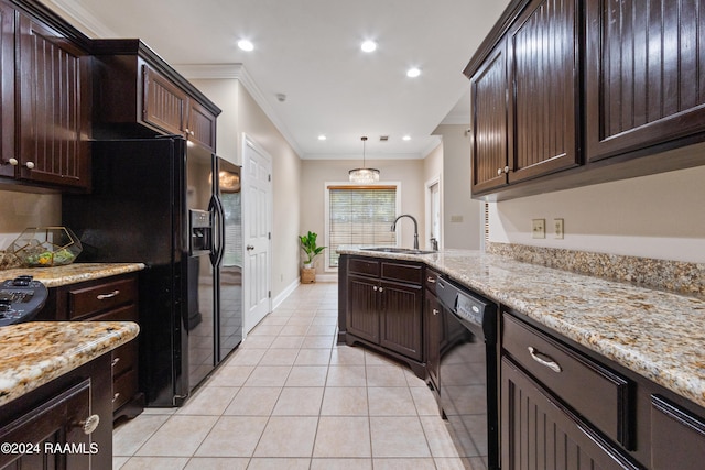 kitchen with ornamental molding, dark brown cabinets, sink, black appliances, and hanging light fixtures