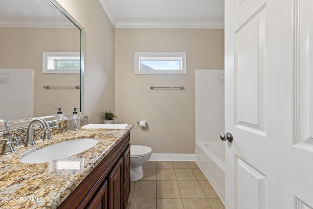 bathroom featuring vanity, crown molding, tile patterned flooring, toilet, and a tub to relax in