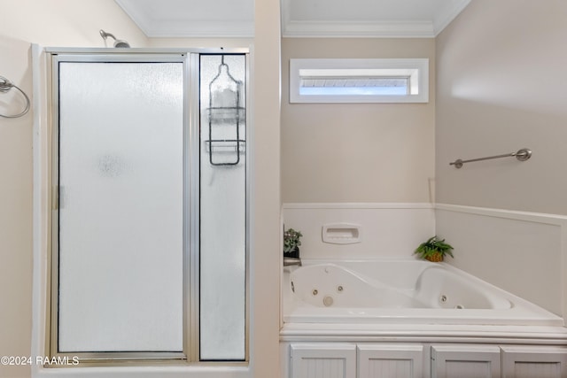 bathroom with separate shower and tub and ornamental molding