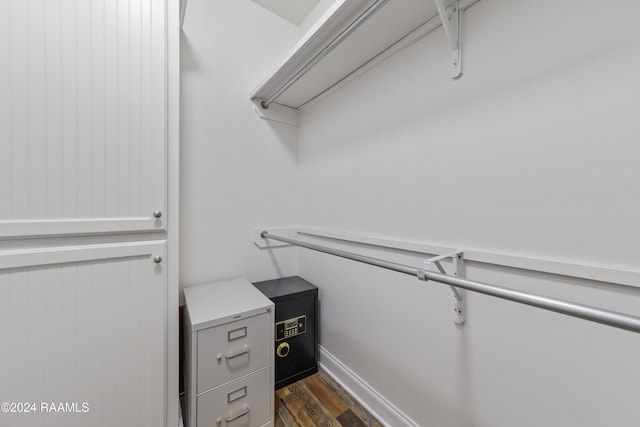 walk in closet featuring dark wood-type flooring