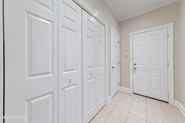 doorway to outside with light tile patterned flooring and crown molding