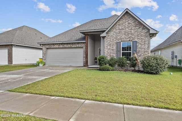 view of front of home featuring a garage and a front lawn