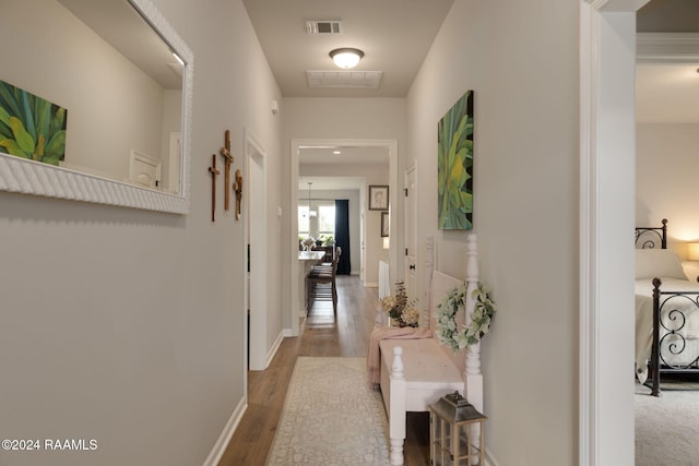 122 Cainwood Ct, Carencro, LA 70520 - hallway with wood finished floors and baseboards