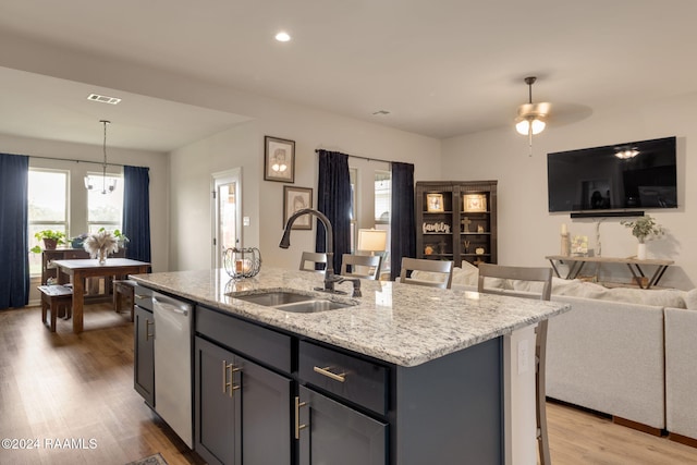 122 Cainwood Ct, Carencro, LA 70520 - kitchen with a sink, open floor plan, dishwasher, light wood-type flooring, and a center island with sink
