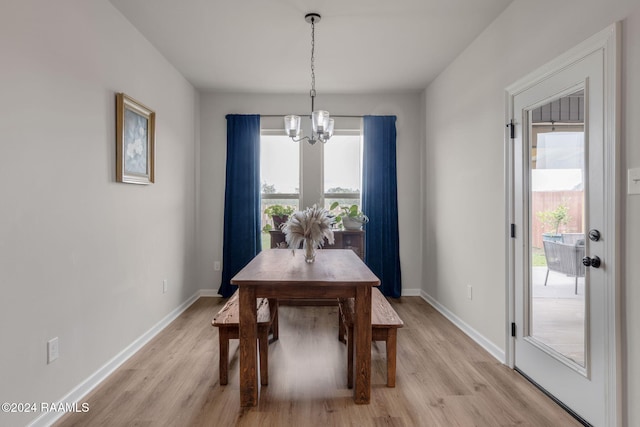 122 Cainwood Ct, Carencro, LA 70520 - dining area featuring a chandelier, healthy amount of natural light, and light wood-style floors