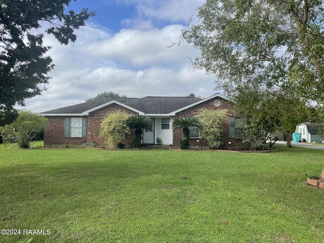 single story home with a front yard