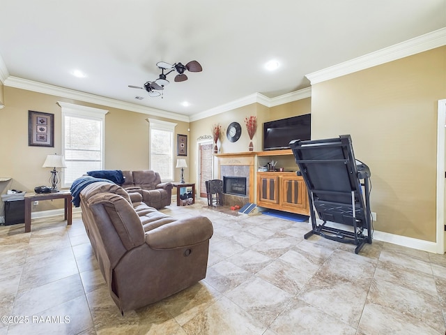 living room featuring a tile fireplace and crown molding