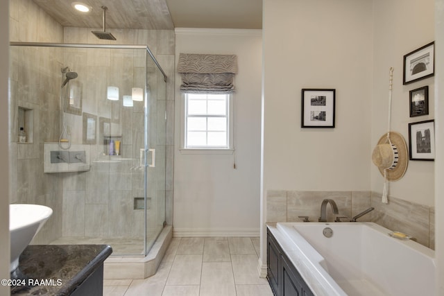 bathroom with ornamental molding, tile patterned flooring, shower with separate bathtub, and vanity