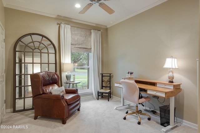 carpeted office space featuring ceiling fan and crown molding