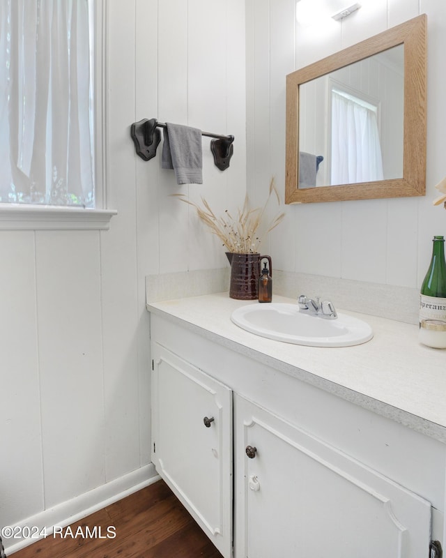 bathroom with wood-type flooring and vanity