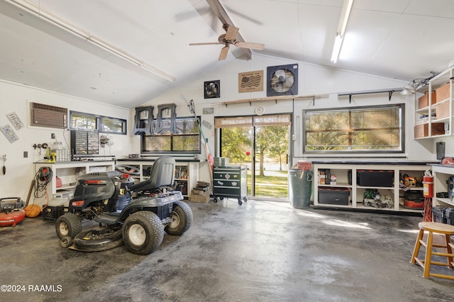 garage with a workshop area and ceiling fan