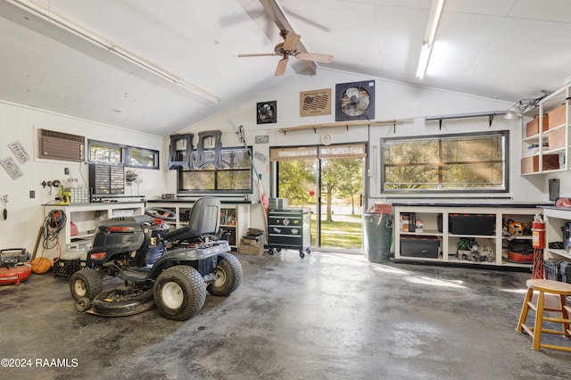 4106 Walnut Dr, New Iberia, LA 70563 - garage with a workshop area and a ceiling fan
