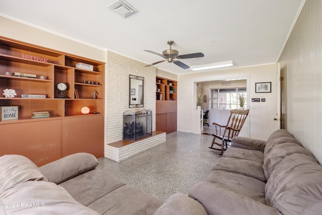 living room featuring built in shelves, ceiling fan, and crown molding