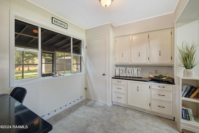 kitchen with white cabinets and ornamental molding