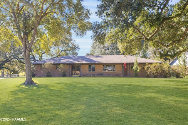 ranch-style home with a front yard