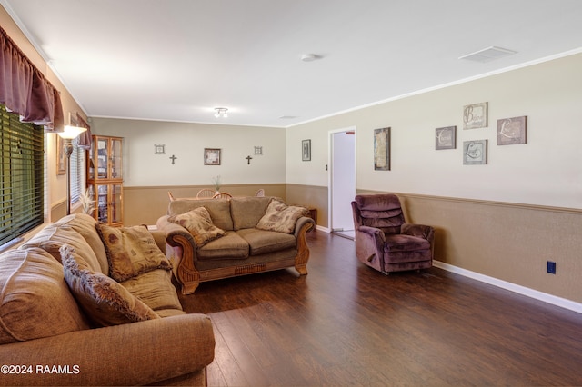 living room featuring crown molding and dark hardwood / wood-style floors