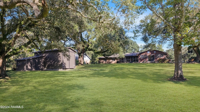 4106 Walnut Dr, New Iberia, LA 70563 - view of green lawn featuring an outbuilding