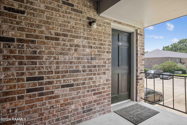 entrance to property with a balcony