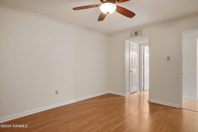 unfurnished room featuring ceiling fan, ornamental molding, and light hardwood / wood-style flooring