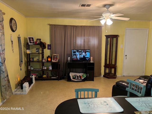 living room featuring ceiling fan and ornamental molding