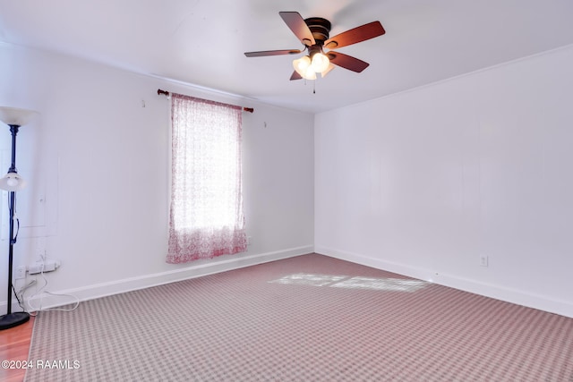 empty room featuring carpet and ceiling fan