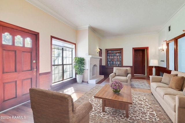 living room featuring hardwood / wood-style flooring and crown molding