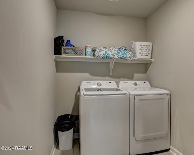 laundry area featuring washer and dryer and tile patterned floors