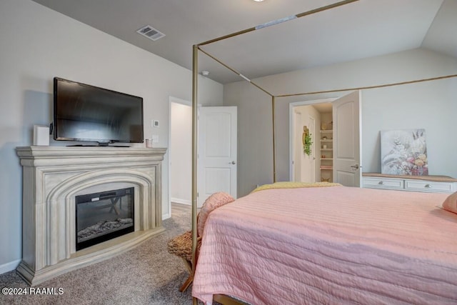 bedroom with lofted ceiling and carpet