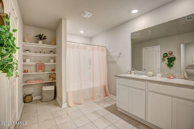 bathroom with vanity and tile patterned floors